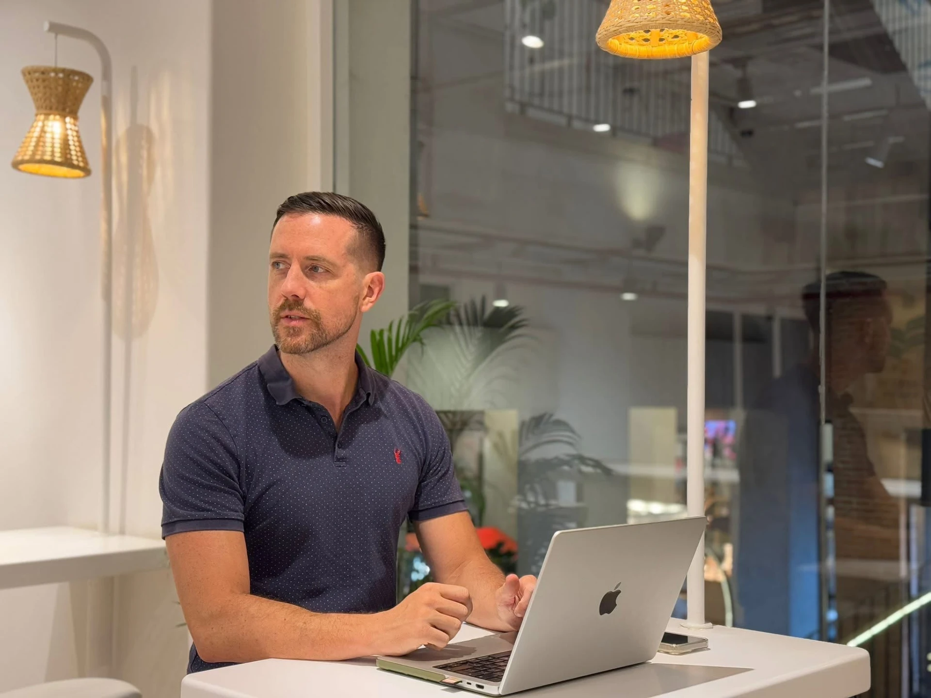 Pete Scott working at a laptop
